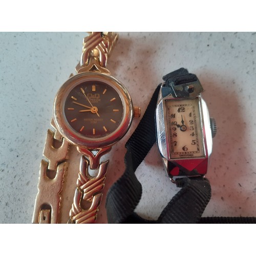 22 - Gucci- A ladies Gucci silver tone watch, serial no:9000L and 3 mixed watches to include a ladies gol... 