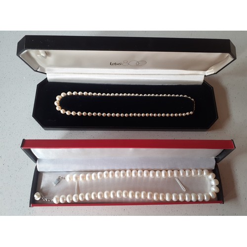 70 - A Lotus pearl necklace having a 9ct gold clasp stamped 375, makers mark A Ld ( A Ltd), 41cm long in ... 