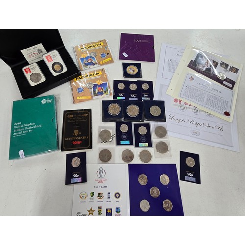 440 - A collection of coin sets to include 2019 Paddington at St Pauls and The Tower presentation packs, 2... 