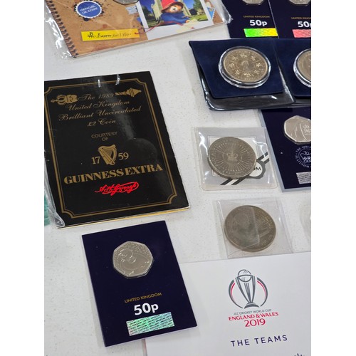 440 - A collection of coin sets to include 2019 Paddington at St Pauls and The Tower presentation packs, 2... 