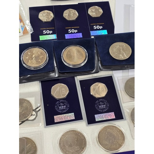 440 - A collection of coin sets to include 2019 Paddington at St Pauls and The Tower presentation packs, 2... 