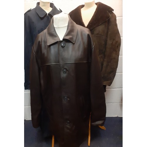 453 - Three late 20th Century gents coats comprising a Rainman of London navy full length rain mac size 44... 