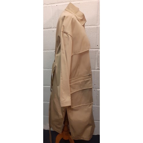 29 - Courreges of Paris-An unused beige 'Manteau' trench coat, approx 46