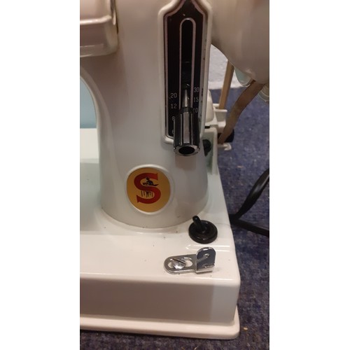 43 - A 1964 cased white Singer No:221k featherweight 'Red S' sewing machine, serial number EV971266 with ... 