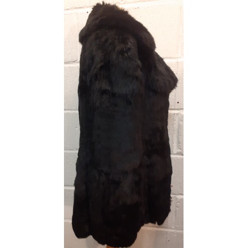 78 - Two fur jackets comprising a late 20th Century black coney soft fur jacket with shawl collar, UK siz... 