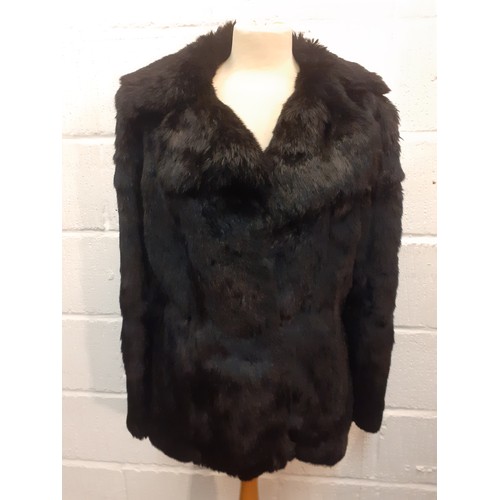 78 - Two fur jackets comprising a late 20th Century black coney soft fur jacket with shawl collar, UK siz... 