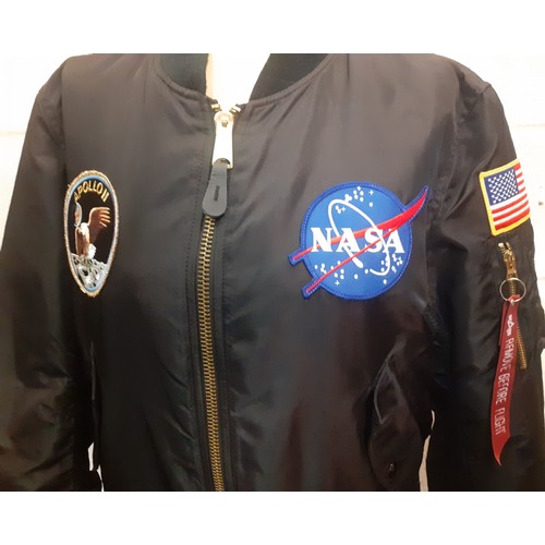 79 - An Alpha Industries black nylon Nasa Apollo II bomber jacket with embroidered fabric badges to front... 