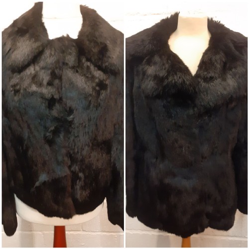 78 - Two fur jackets comprising a late 20th Century black coney soft fur jacket with shawl collar, UK siz... 