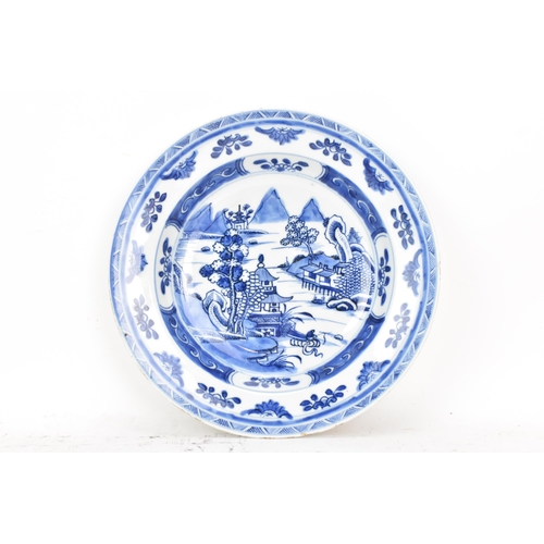 100 - A Chinese export Qing dynasty blue and white dish, Qianlong, 18th century, depicting a central 
scen... 