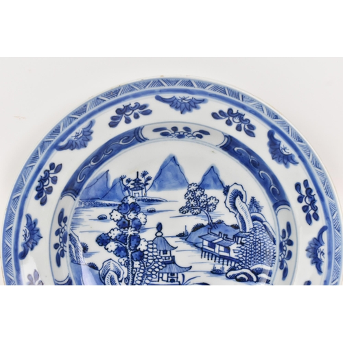 100 - A Chinese export Qing dynasty blue and white dish, Qianlong, 18th century, depicting a central 
scen... 