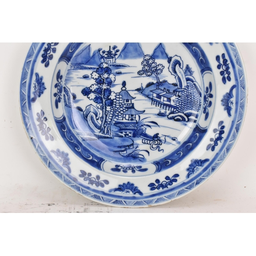 100 - A Chinese export Qing dynasty blue and white dish, Qianlong, 18th century, depicting a central 
scen... 