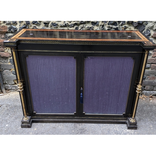 132 - A Regency ebonised chiffonier having two glazed doors, fitted with a loose shelf, flanked by two bra... 