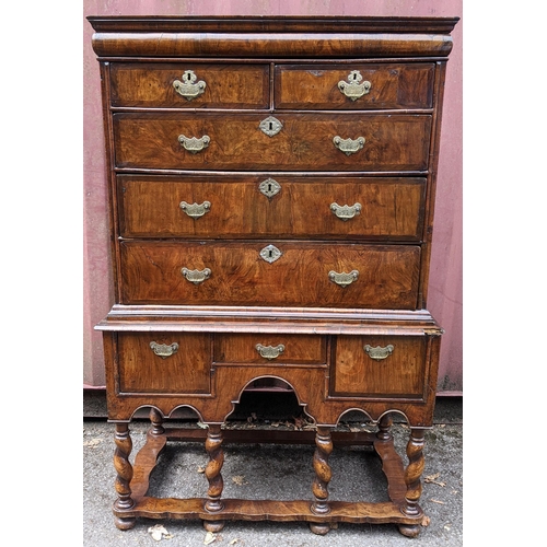 145 - An early 18th century walnut chest on stand having a moulded cornice, cushion moulded drawer, eight ... 