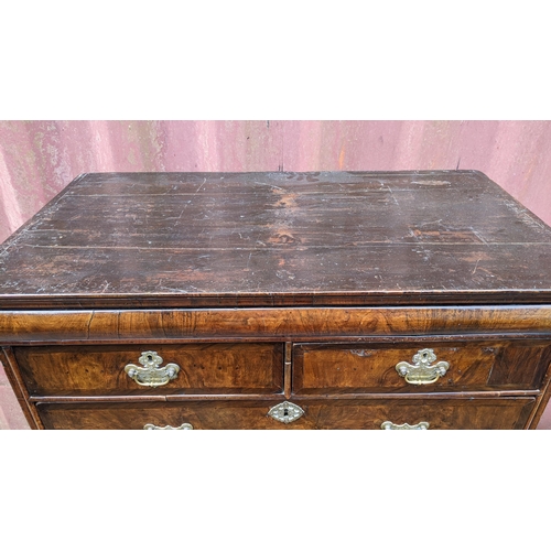 145 - An early 18th century walnut chest on stand having a moulded cornice, cushion moulded drawer, eight ... 