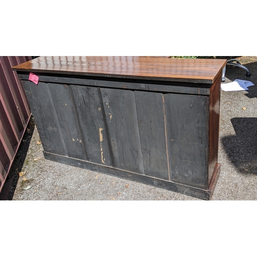 164 - A Regency rosewood breakfront sideboard, having four cupboard doors opening to reveal shelves, with ... 