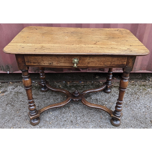 165 - A circa 1700 walnut side table, having a single frieze drawer, four baluster and knop turned legs un... 