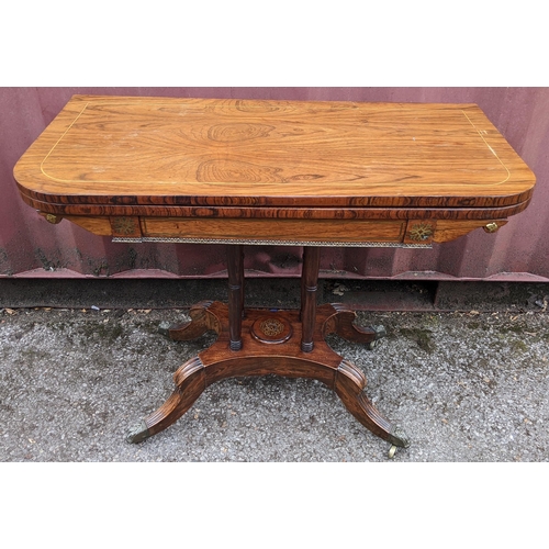 166 - A Regency rosewood card table, having string inlaid top, green playing baize, gilt metal mounts and ... 