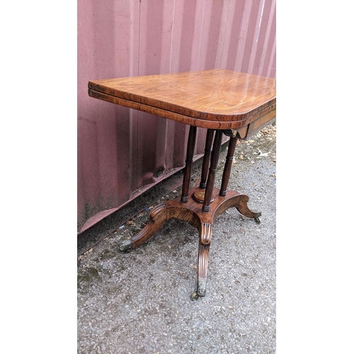 166 - A Regency rosewood card table, having string inlaid top, green playing baize, gilt metal mounts and ... 