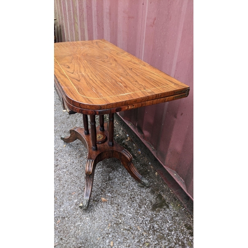 166 - A Regency rosewood card table, having string inlaid top, green playing baize, gilt metal mounts and ... 