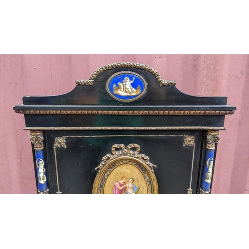 168 - A Napoleon III ebonised and ormolu mounted lady