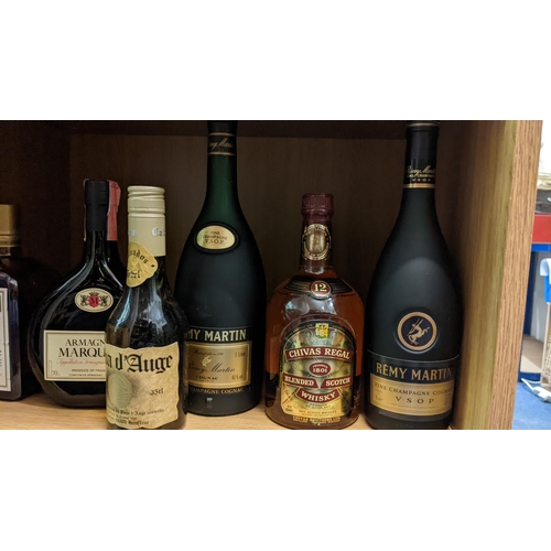 280 - Collection of spirits to include: Sobieski, Calva d'Auge, Cointreau, Armagnac Marquisa, Remy Martin,... 