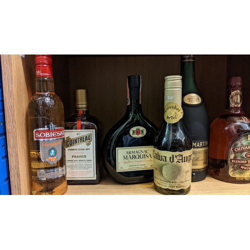 280 - Collection of spirits to include: Sobieski, Calva d'Auge, Cointreau, Armagnac Marquisa, Remy Martin,... 