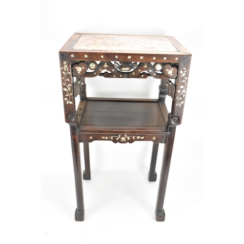 84 - A Chinese late Qing dynasty padouk wood two tier table, having a rectangular top inset with marble, ... 