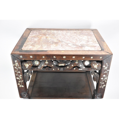 84 - A Chinese late Qing dynasty padouk wood two tier table, having a rectangular top inset with marble, ... 