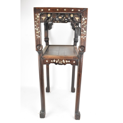 84 - A Chinese late Qing dynasty padouk wood two tier table, having a rectangular top inset with marble, ... 