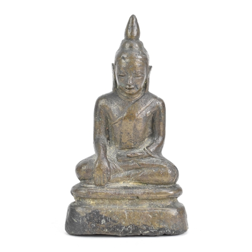 85 - A Thai, Lanna style bronze figure of Buddha Shakyamuni seated in virasana on a shaped base, his righ... 