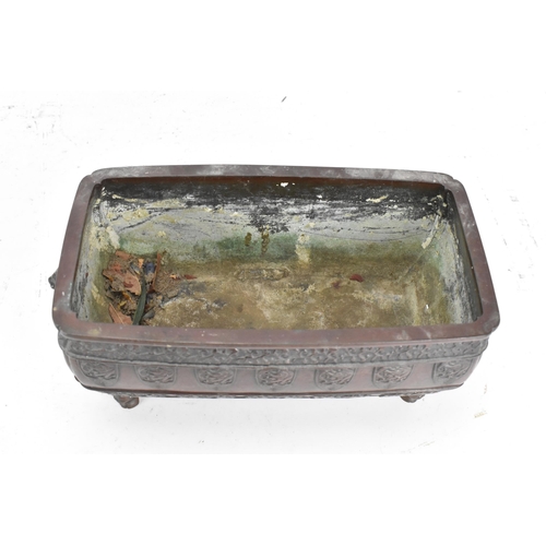 95 - A Japanese Meiji period twin handled bronze bonsai planter, of rectangular form and having taotie og... 