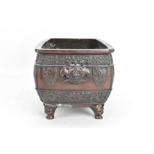 95 - A Japanese Meiji period twin handled bronze bonsai planter, of rectangular form and having taotie og... 