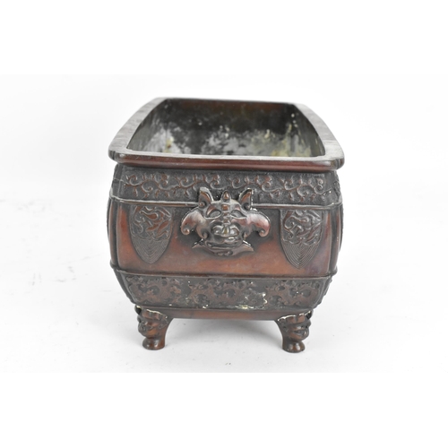 95 - A Japanese Meiji period twin handled bronze bonsai planter, of rectangular form and having taotie og... 