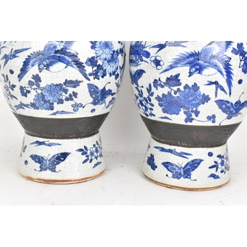 99 - A pair of Chinese late Qing dynasty nanking crackle glazed blue and white vases, late 19th century, ... 