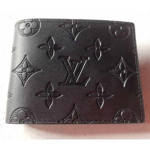 1 - THIS LOT HAS BEEN WITHDRAWN


Louis Vuitton- An unused black 'Monogram Shadow' calfskin multiple wal... 