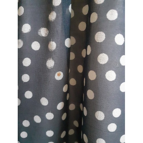 6 - Hardy Amies- A navy full length gown with white polka dot design throughout, having a double full le... 