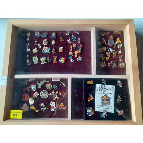 81 - A collection of police charity and other charity pin badges to include Magic Roundabout tie pins, ci... 