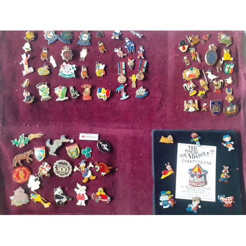 81 - A collection of police charity and other charity pin badges to include Magic Roundabout tie pins, ci... 