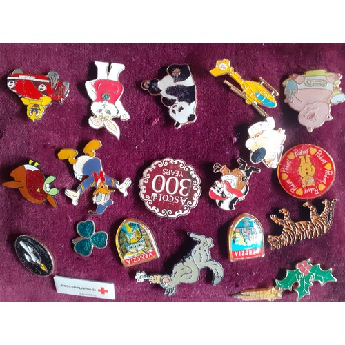 81 - A collection of police charity and other charity pin badges to include Magic Roundabout tie pins, ci... 