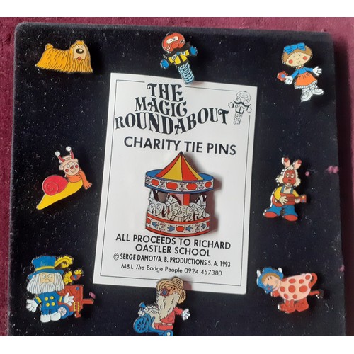 81 - A collection of police charity and other charity pin badges to include Magic Roundabout tie pins, ci... 