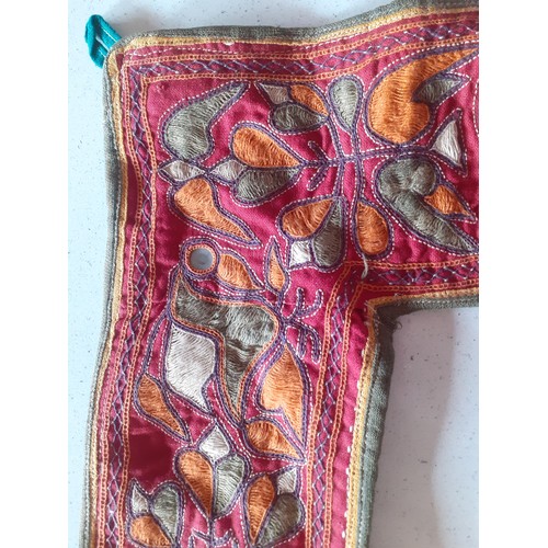 84 - A quantity of Banjara mirrored and embroidered bags, a traditional and elaborately embroidered India... 