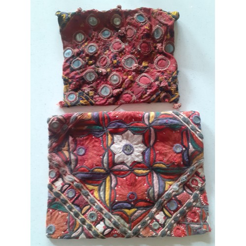 84 - A quantity of Banjara mirrored and embroidered bags, a traditional and elaborately embroidered India... 