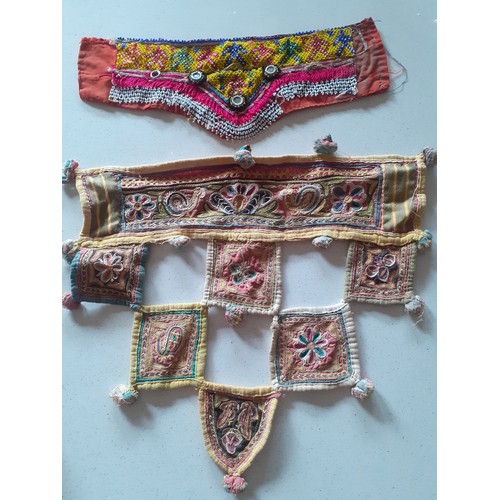 84 - A quantity of Banjara mirrored and embroidered bags, a traditional and elaborately embroidered India... 