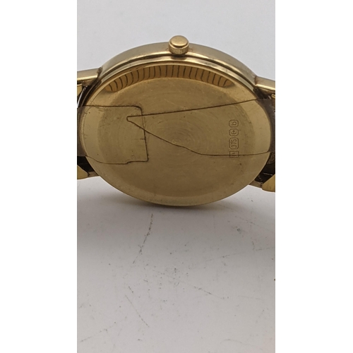 37 - A 9ct gold gents Ingersoll wristwatch on a gold plated expanding bracelet, total weight 41g
Location... 