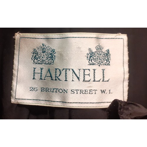 52 - Hartnell, British Designer- A black evening jacket with ruffled collar and cuffs approx 38