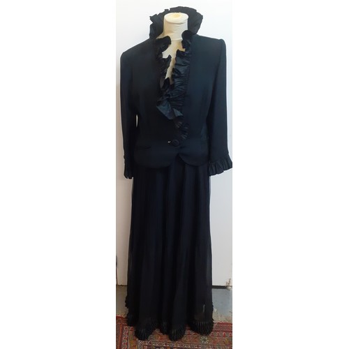 52 - Hartnell, British Designer- A black evening jacket with ruffled collar and cuffs approx 38