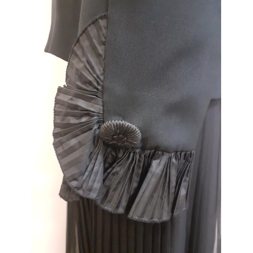 52 - Hartnell, British Designer- A black evening jacket with ruffled collar and cuffs approx 38