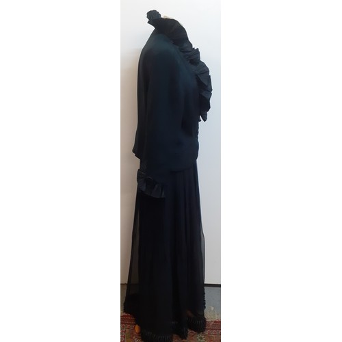 52 - Hartnell, British Designer- A black evening jacket with ruffled collar and cuffs approx 38