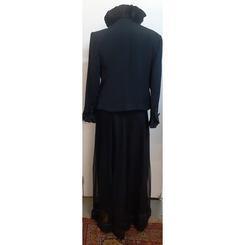 52 - Hartnell, British Designer- A black evening jacket with ruffled collar and cuffs approx 38