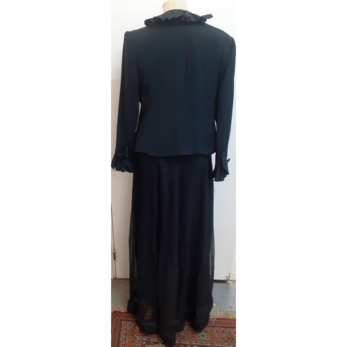 52 - Hartnell, British Designer- A black evening jacket with ruffled collar and cuffs approx 38